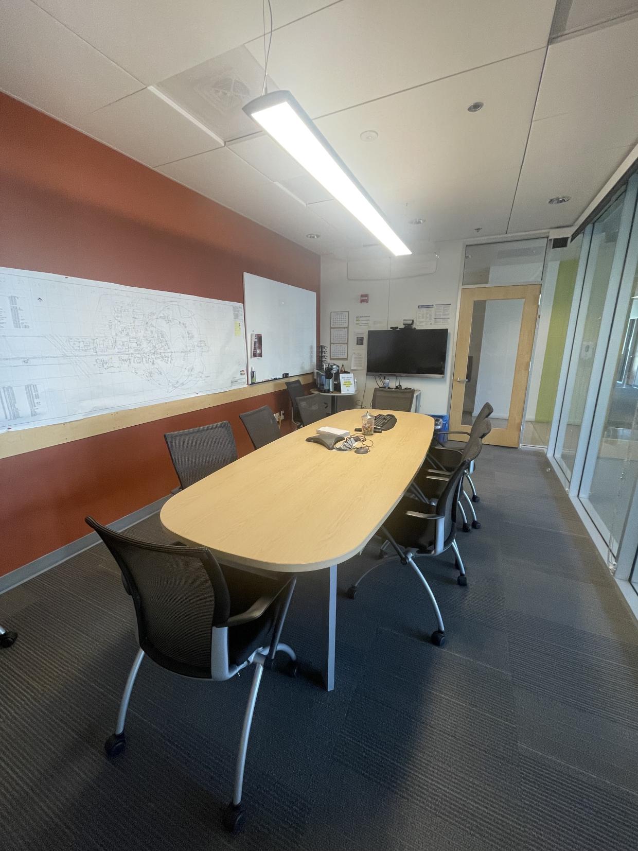 Table , chairs, white board and display screen 