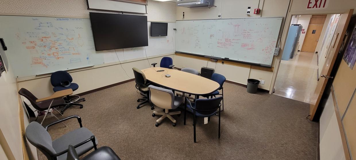 meeting table , chairs , display Tv and white board