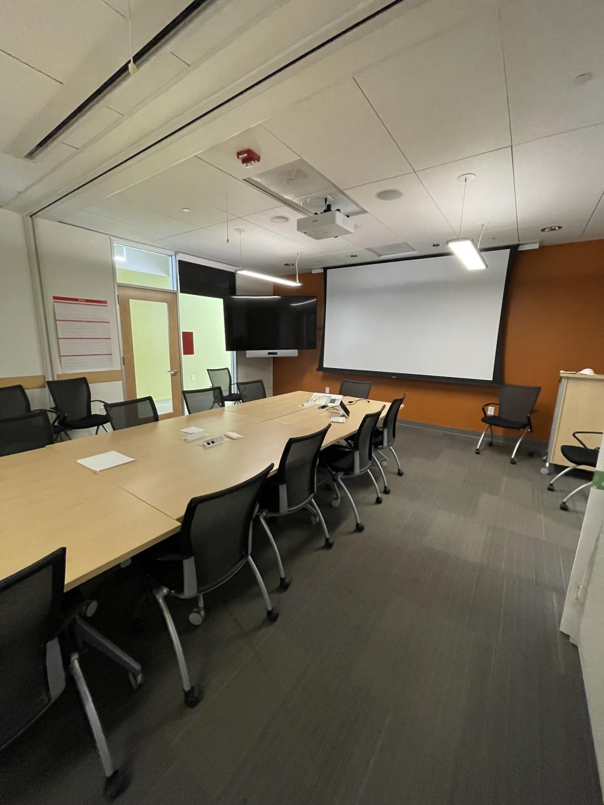 table , chairs , projector , white board 