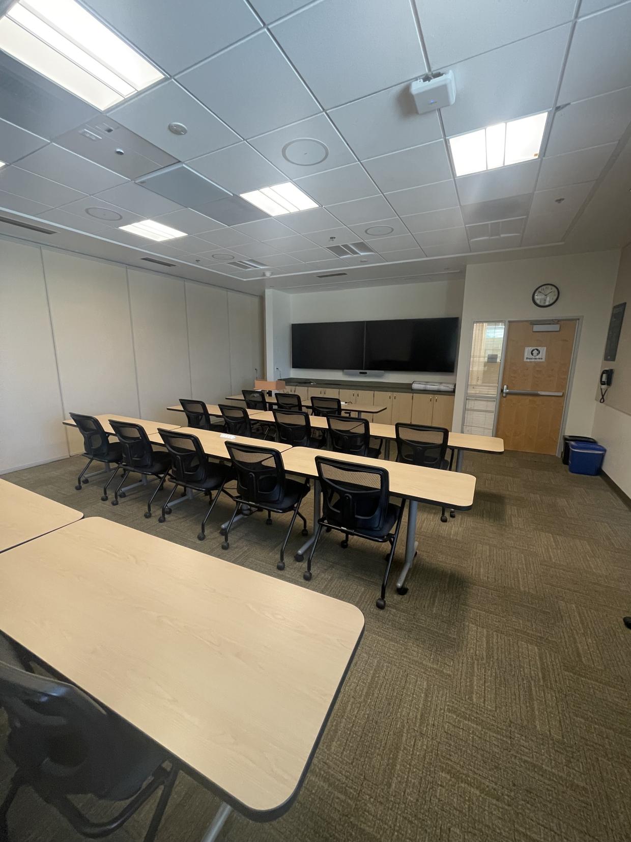 Table , chairs , display screen