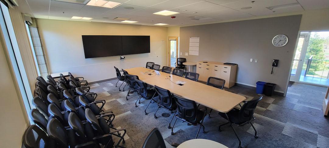 Table , chairs , display screen