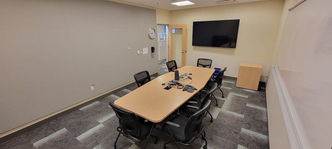 Table , chairs , display screen