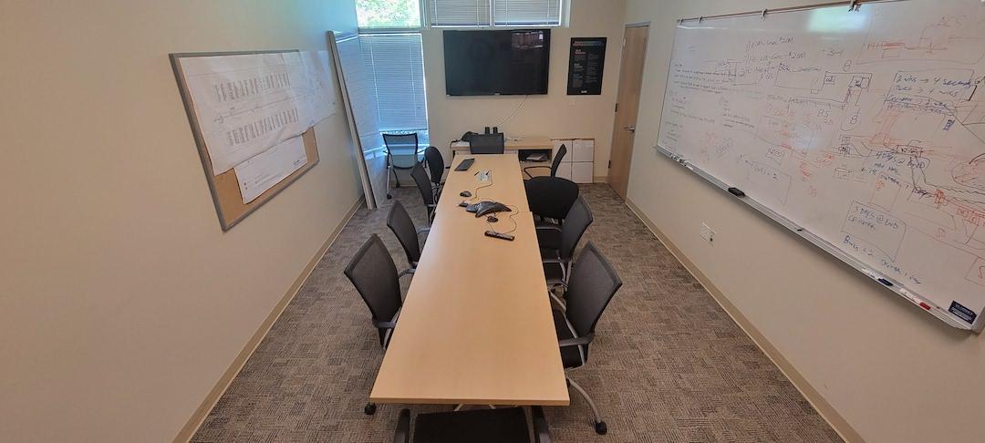 table, chairs, white board and display screen