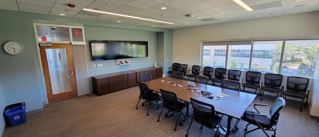 Table , chairs , display screen 