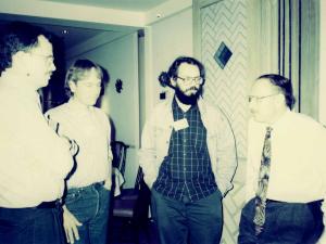 john and colleagues standing and talking